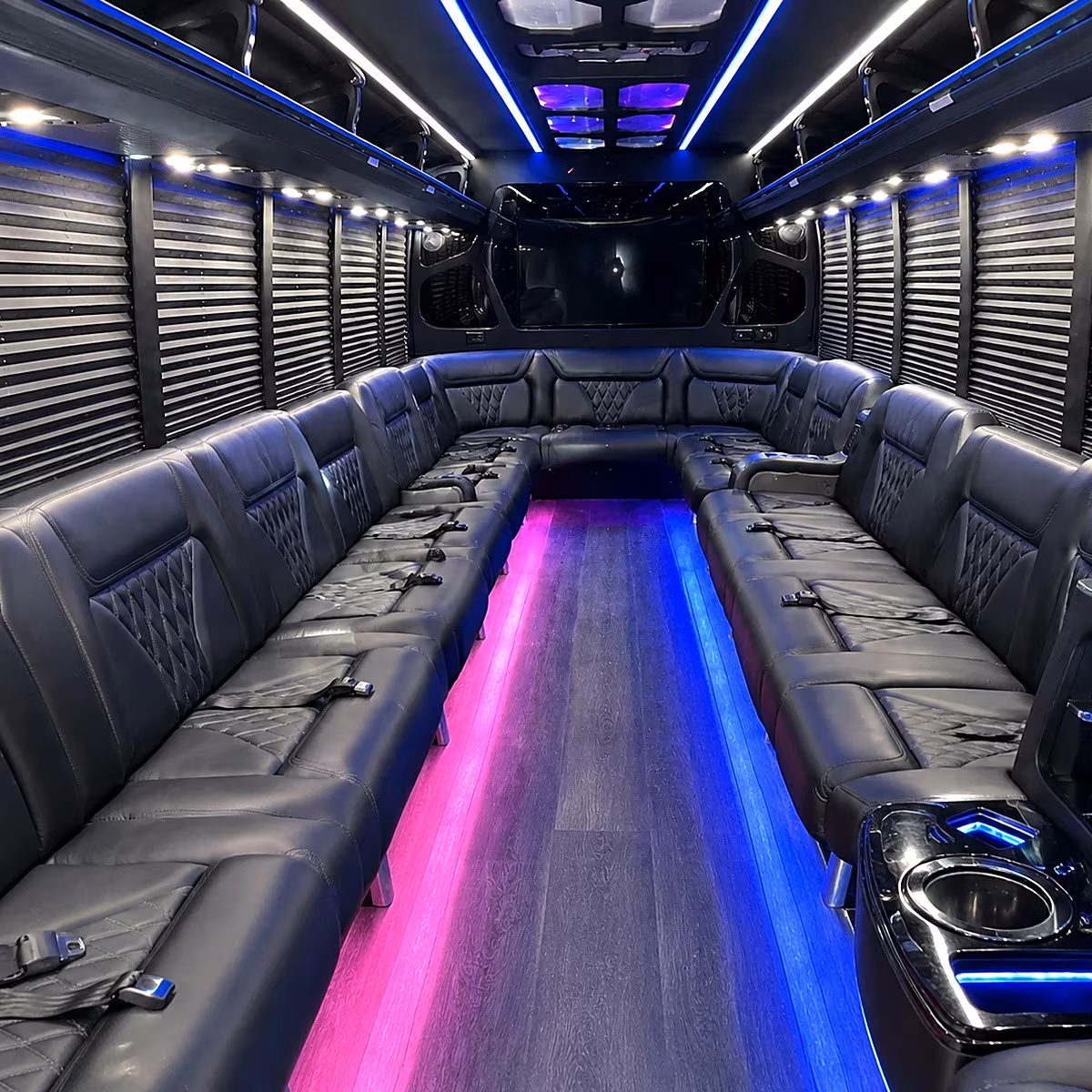 Friends laughing during a party bus celebration in Chandler